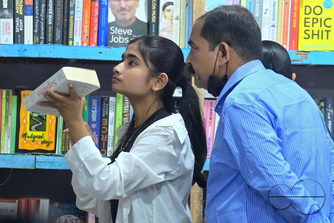 People looking at books in a book stall at the 42nd Agartala Book fair International Fair Ground, Hapania at Agartala