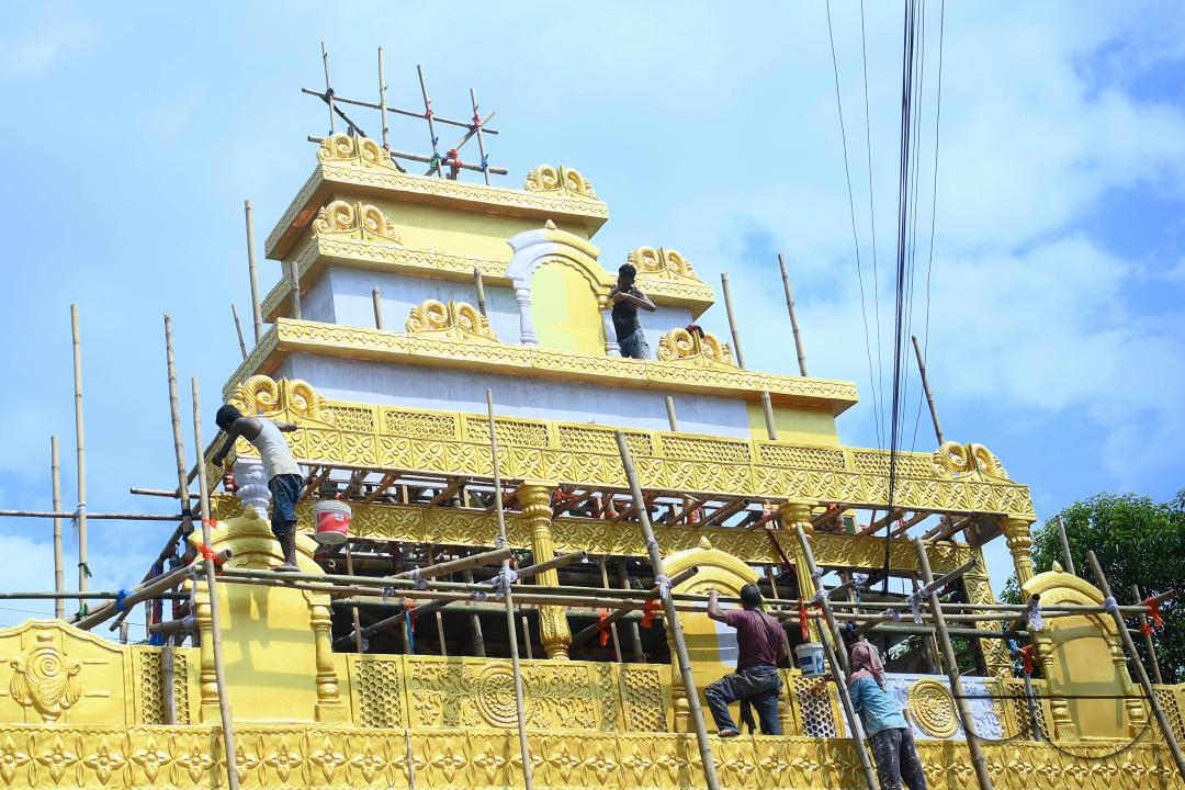 Workers are making a pandal, a temporary structure set up to usually venerate the God and Goddess, ahead of Ganesh Chaturthi festival in Agartala