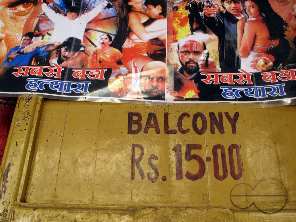 INDIA.Film posters outside an old picture house in Mumbai.