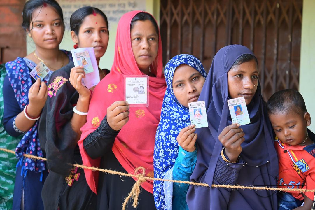 Muslim voters patiently await their turn to cast their votes at a Boxanagar polling station in Agartala in the first phase of Lok Sabha elections