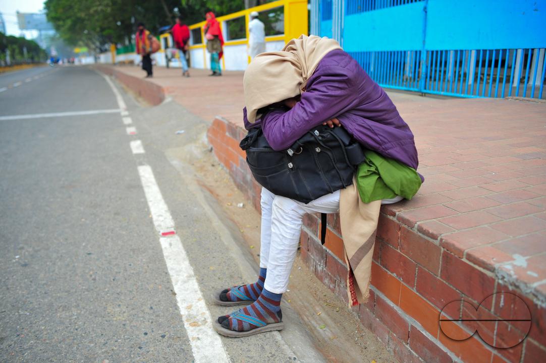 Covering their bodies from head to toe with whatever they can manage, homeless people sleep out in the open in the shivering cold near the Government Alia Madrasa in Sylhet city's Chowhatta area