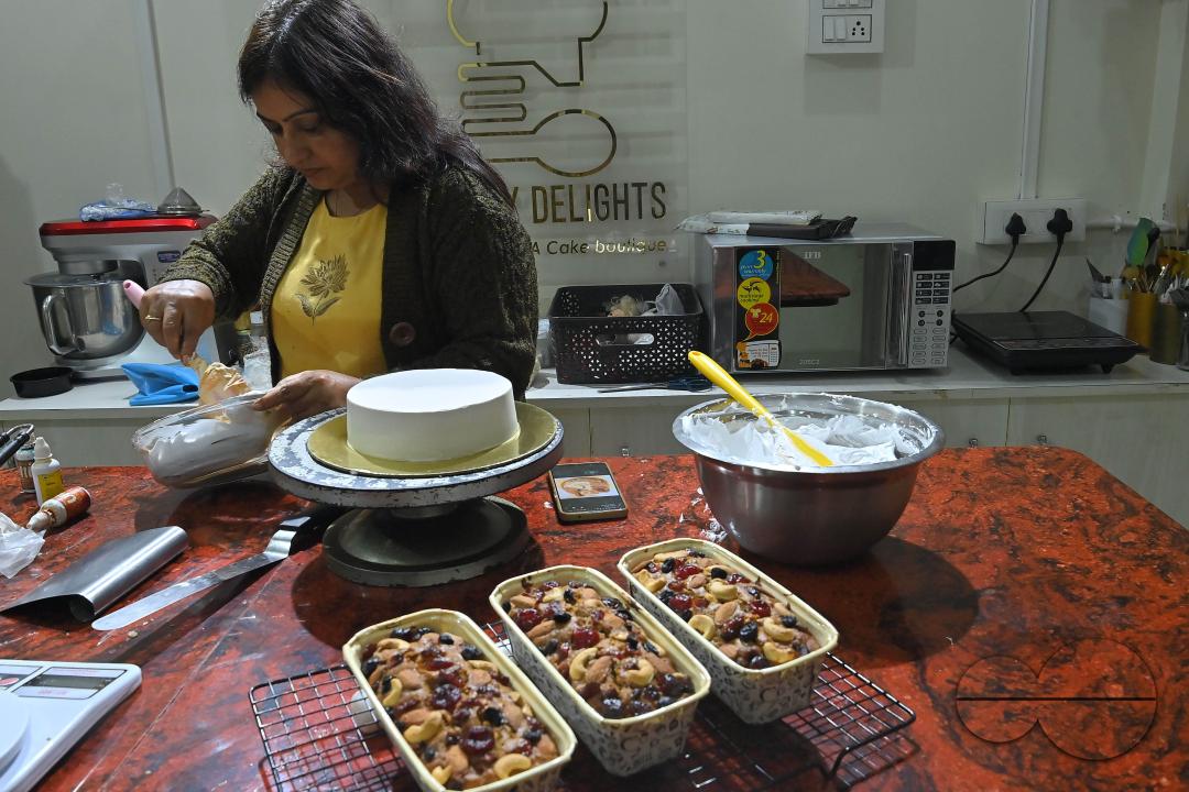 Sutapa Choudhary, a cake artist and teacher, making cakes at her cake parlour, "CREAMY DELIGHTS"