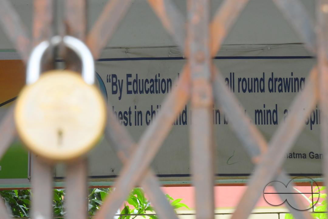 A locked gate of a government school during cyclone MidhiliÂ in Agartala