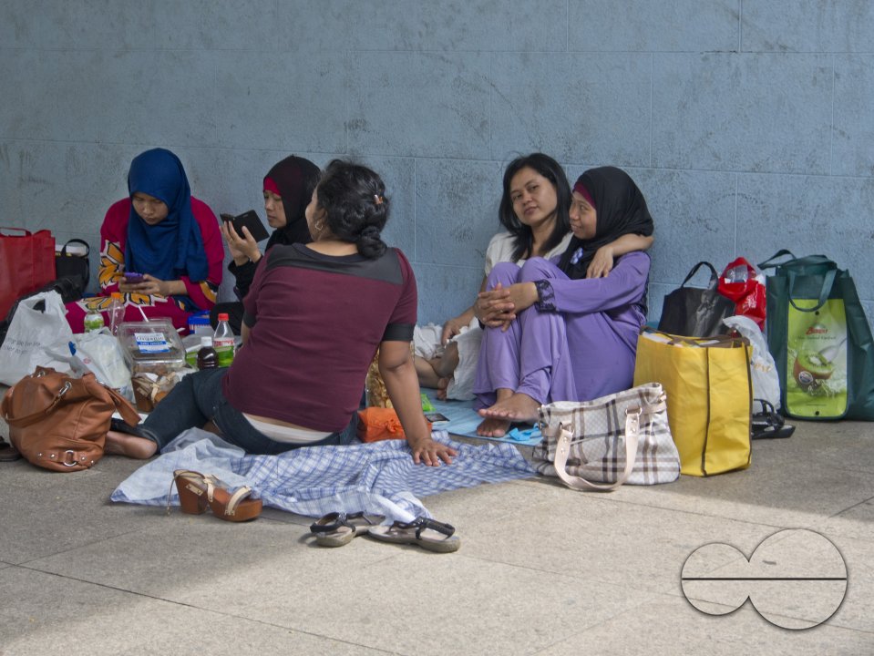 Migrant domestic workers enjoy a day off by the Bay side in Singapore