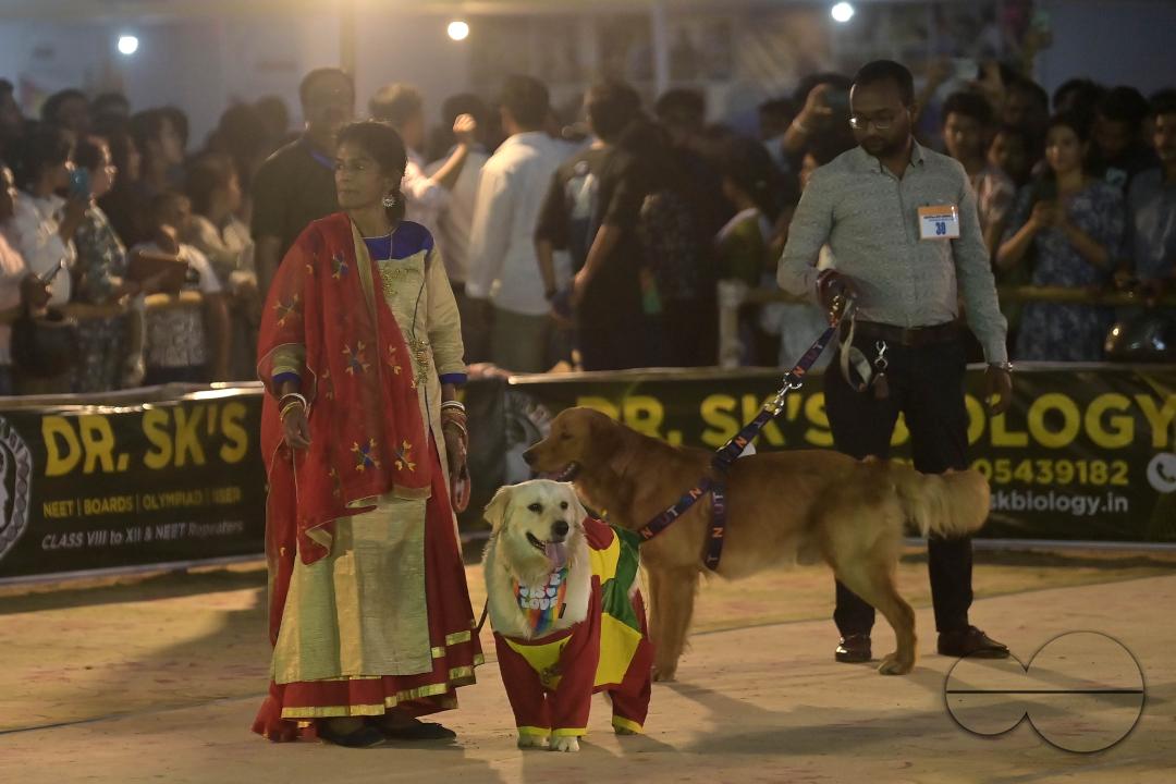 Dogs performing trainers during the Agartala Dog Carnival-2024, organized by Tripura Veterinary Doctors Association & Pawsome (A social organisation) at Agartala