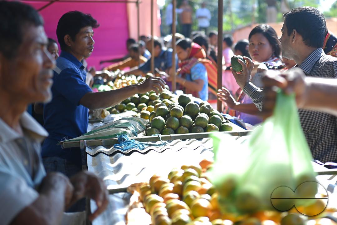 People are buying oranges during the Orange Festival in Taibaglai Village (Killa) organized by the Agriculture and Farmers Welfare of Tripura