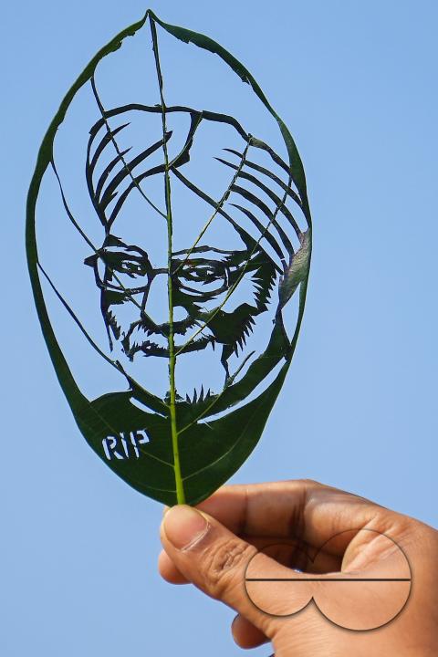 Artist Subham Saha shows his artwork, paying tribute to former prime minister Manmohan Singh, who passed away recently