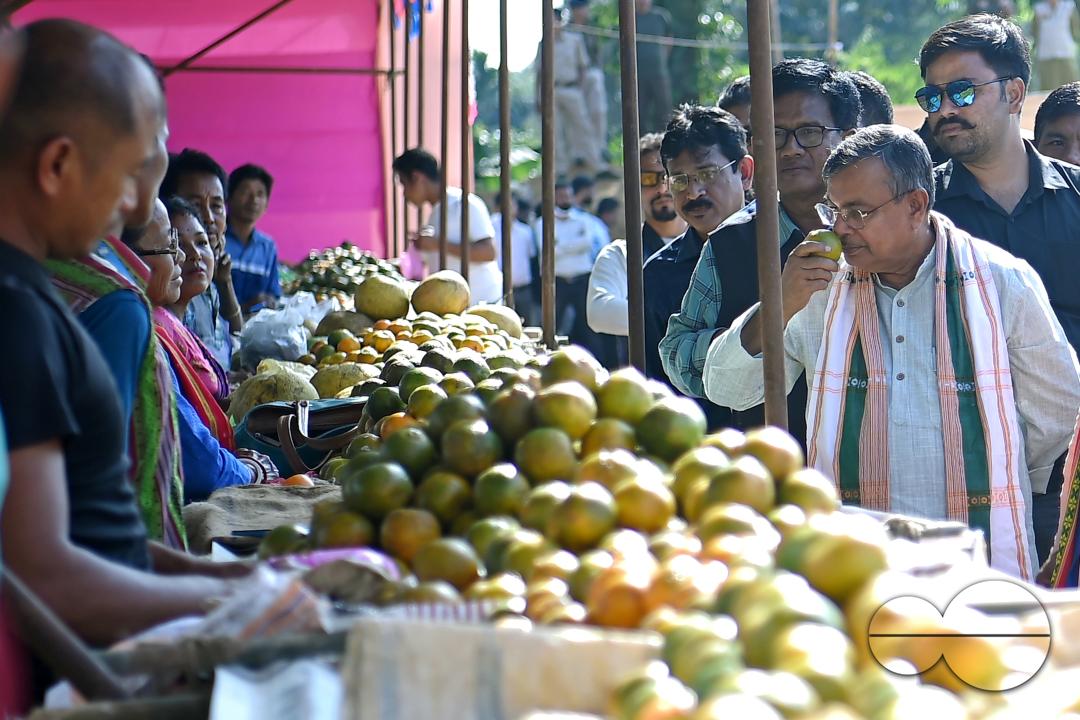 Minister for Agriculture and Farmers Welfare, Ratan Lal Nath inspects oranges during the Orange Festival in Taibaglai Village (Killa) organized by the Agriculture and Farmers Welfare of Tripura