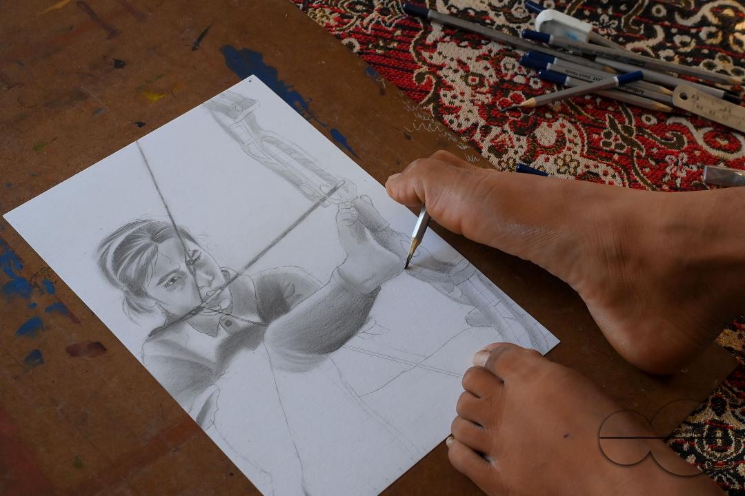 A 23-year-old differently abled artist Pralay Dey, is pursuing his bachelorâs degree in psychology from Tripura Central University
