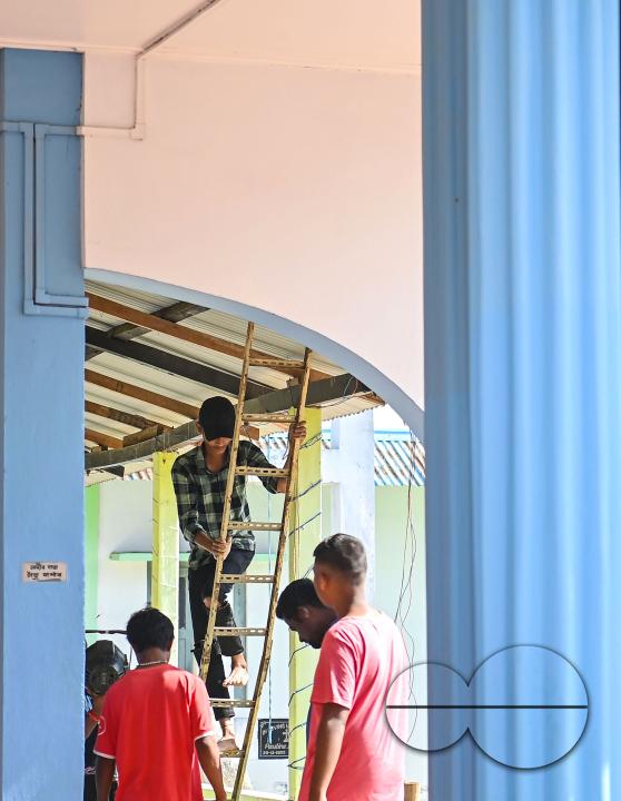 People decorate a church in preparation for Christmas Day at Mariam Church, Agartala