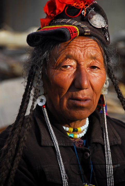 A Ladakhi woman sitting near the temple square in Leh, Ladakh.
