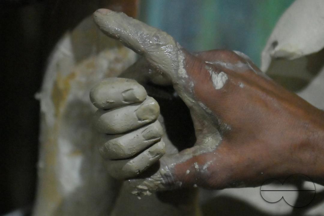 An Idol maker making idols of Lord Ganesh in a studio for the upcoming Ganesh Chaturthi festival at Agartala