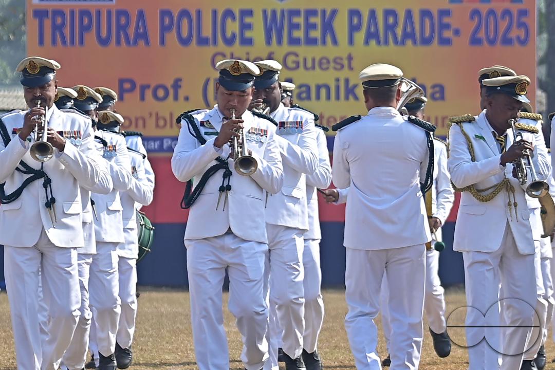 Police personnel from the police band performing at a parade during the celebration of 150 years of Tripura Police Week at the stadium of A.D