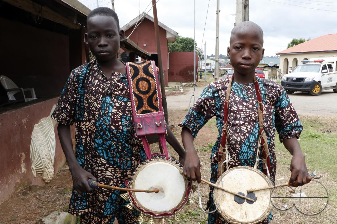 Two young traditional drummers pose for a photograph during the World Sango Festival which is an annual festival held among the Yoruba people in honor of Sango, a thunder and fire deity who was a warrior and the third king of the Oyo Empire after succeed