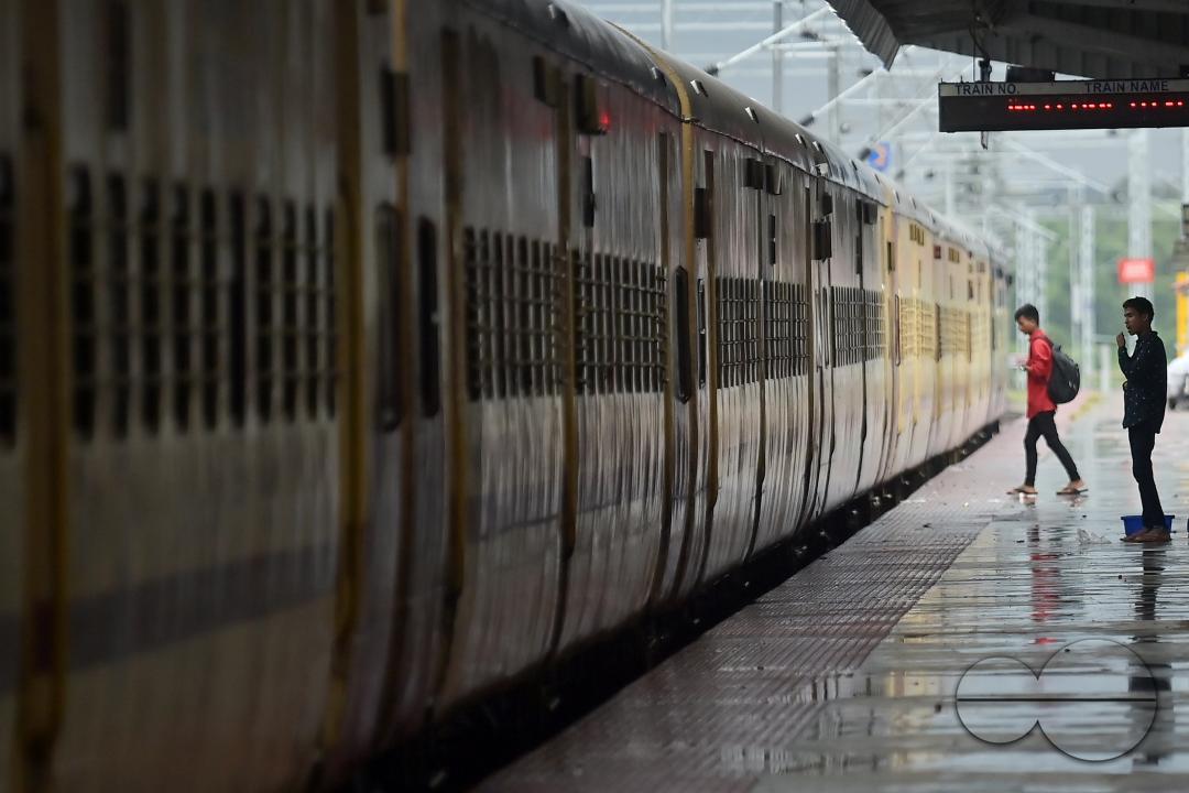 Passengers at the railway station waiting for the interstate train which got cancelled during Cyclone Remal in Agartala
