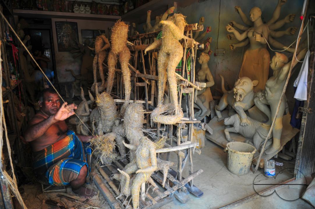 Nondi Pal, an idol artist is working on structures of Hindu Deity in preparation for the upcoming Durga Puja Festival 2023