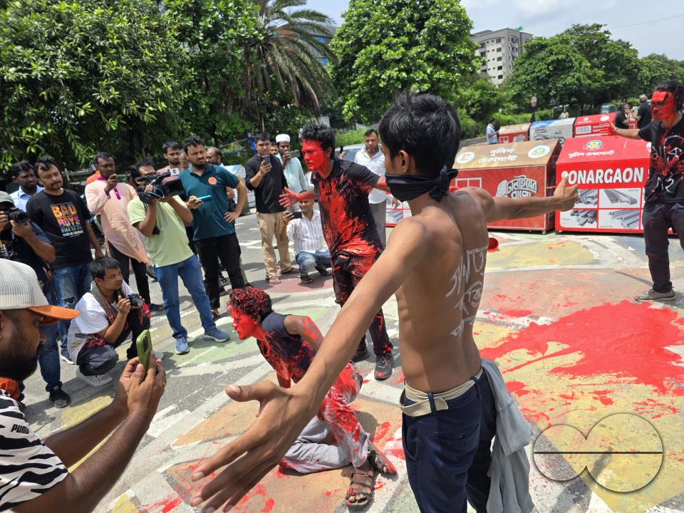 Demonstrators outside the parliament in Dhaka, protesting the shooting of one student by the police during their rally