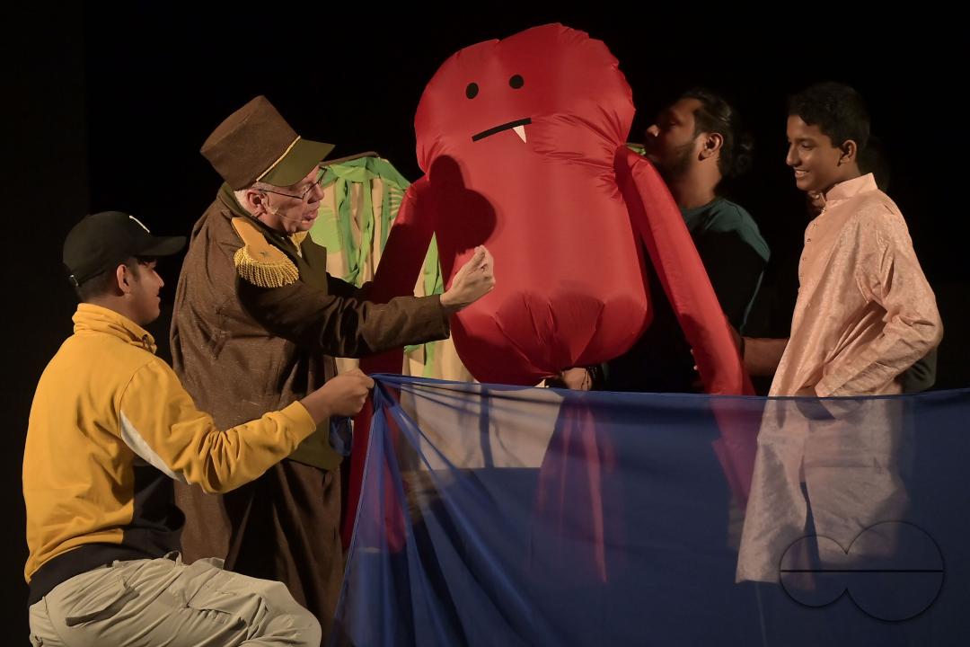 American puppeteer performs with puppets during Tripura International Puppet Utsav 2024 organized by Tripura Puppet Theatre to celebrate 50 years of puppetry excellence
