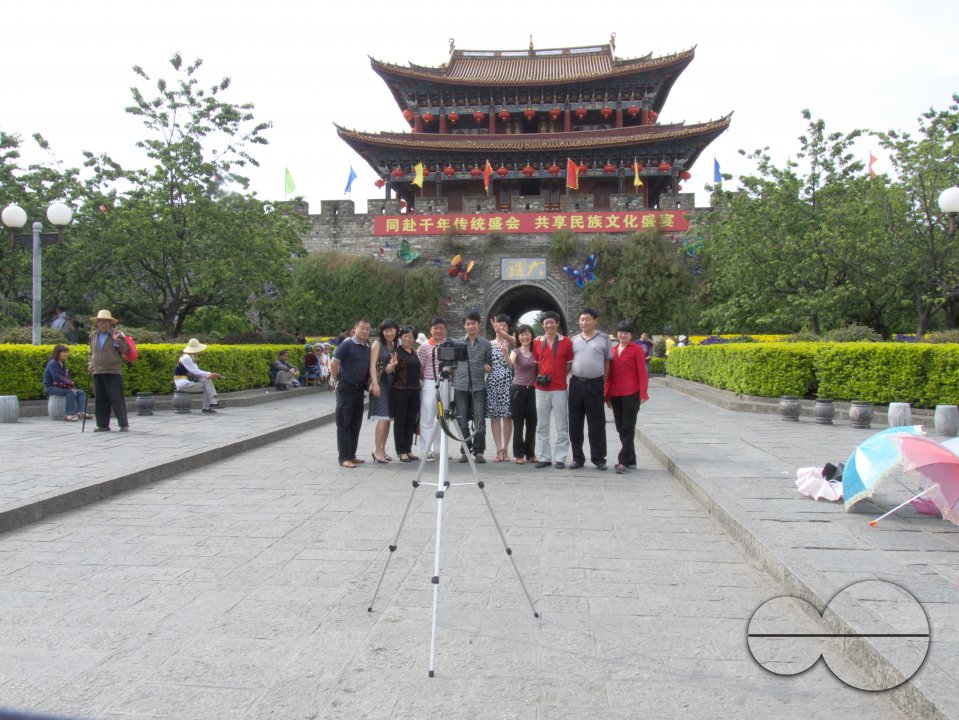 CHINA Family of Chinese tourists haveing a self portrait taken in Dali, Yunnan province.