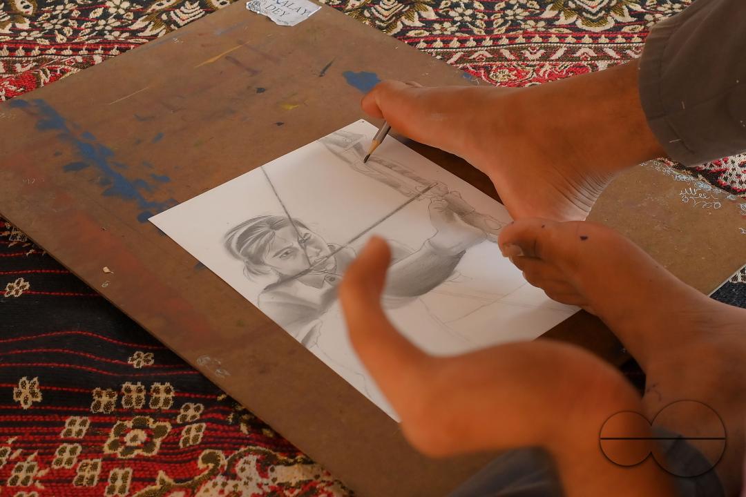 A 23-year-old differently abled artist Pralay Dey, is pursuing his bachelorâs degree in psychology from Tripura Central University