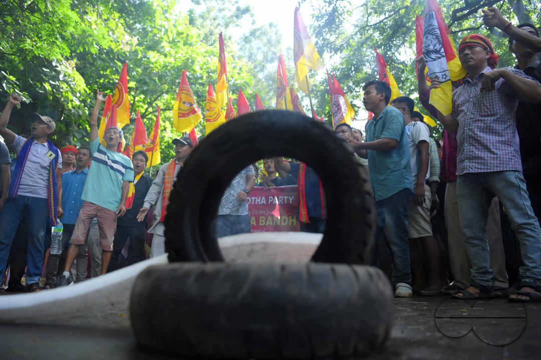 The âTipraha Indigenous Progressive Regional Alliance (TIPRA)ââ supporters raise slogans demanding a separate Greater Tipraland state for tribals, in Bermuda Ashram Para