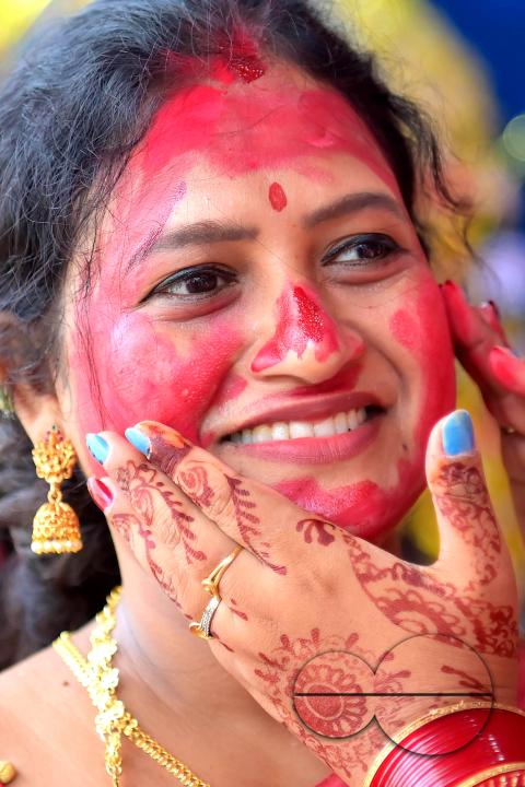 Married women smear each other with vermillion during a ritual called the vermillion game, or "Sindur Khela," on the last day of the Durga Puja festival in Agartala, Tripura, India.