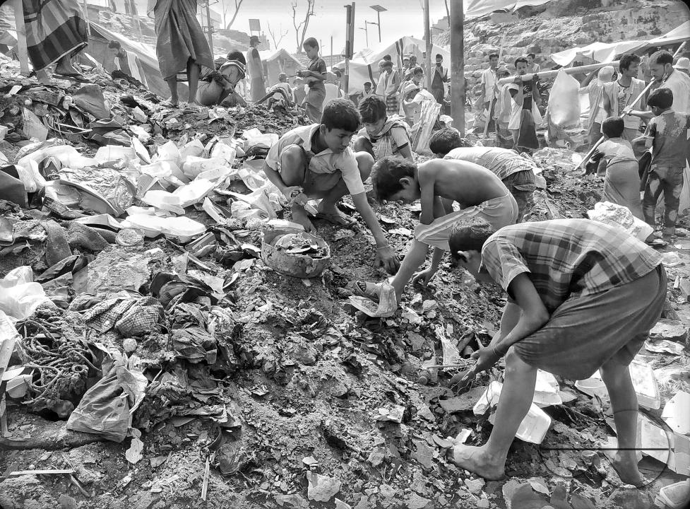 Boys working at a garbage collecting area at the Balukhali refugee camp