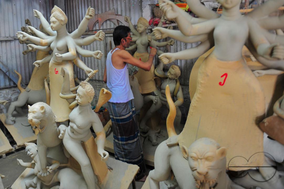 Nondi Pal, an idol artist is working on structures of Hindu Deity in preparation for the upcoming Durga Puja Festival 2023