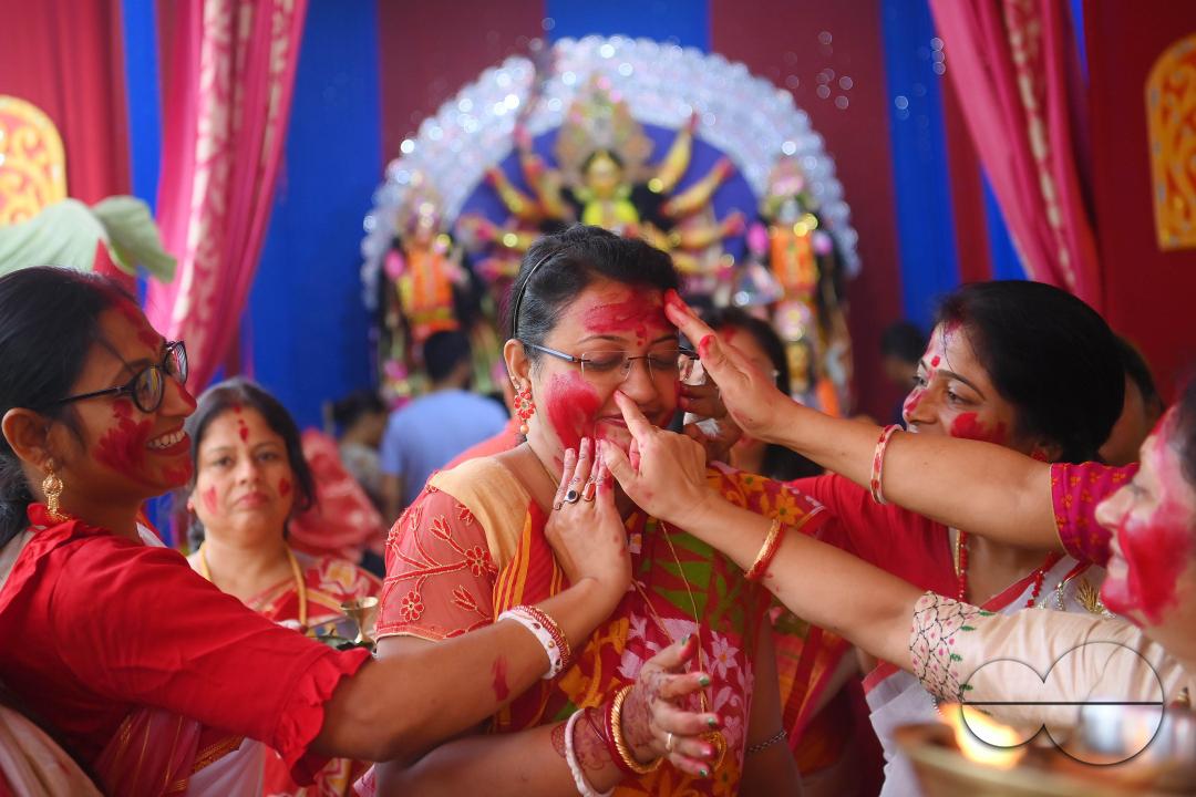 Married ladies smear red Sindoor or Vermillion, a ritual known as Sindur Khela or Vermillion Game on Vijayadashami, the last day of the Durga Puja festival