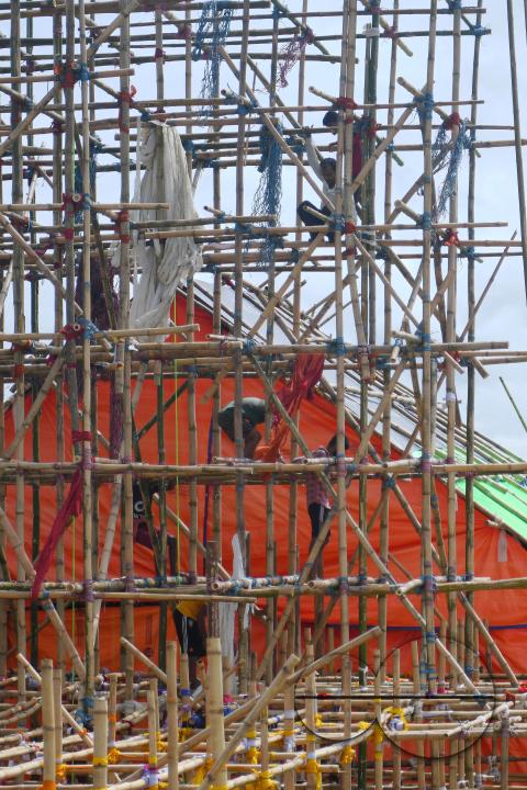 Workers are making a temporary bamboo structure, locally called "Pandal", for the upcoming Durga Puja in Agartala