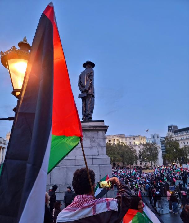 Thousands of protestors raise voices, carry placards and show their support for Palestinians, at Trafalgar Square, central London