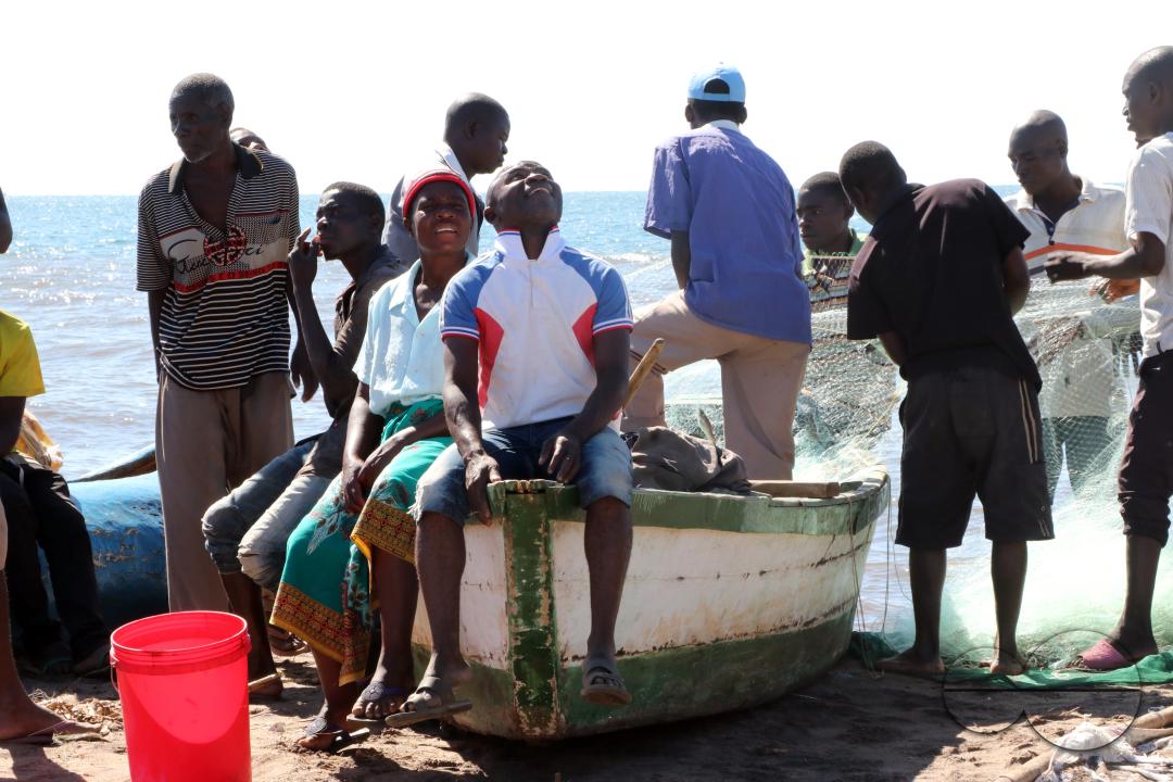 People at the lakeshore in a fishing village in Salima