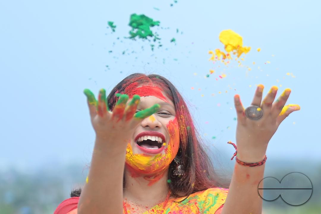 Indian girls adorned with 'Gulal' or coloured powder during the Hindu spring festival 'Holi', the festival of colour in Agartala