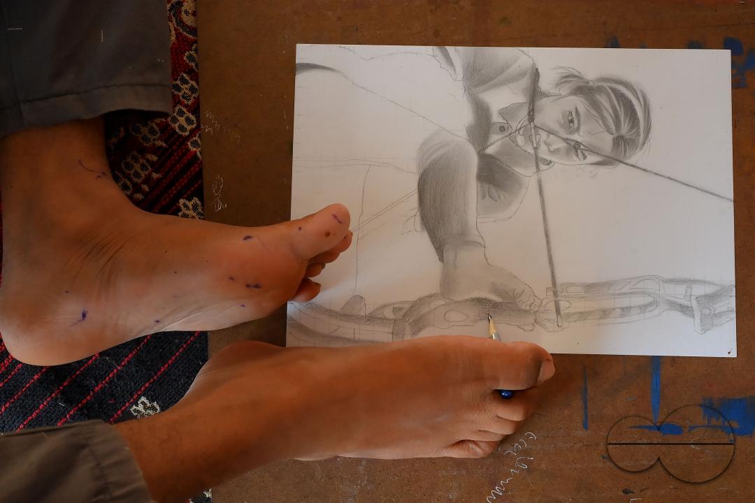 A 23-year-old differently abled artist Pralay Dey, is pursuing his bachelorâs degree in psychology from Tripura Central University