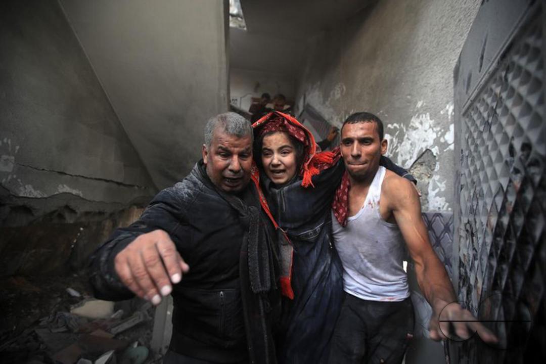 A Palestinian woman, a survivor of the rubble, cries as a result of the Israeli armyâs bombing of her home in Khan Yunis, south of the Gaza Strip