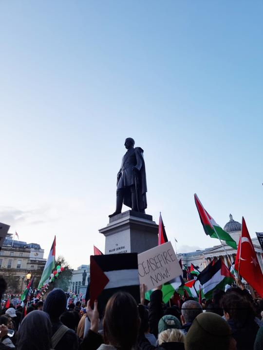 Thousands of protestors raise voices, carry placards and show their support for Palestinians, at Trafalgar Square, central London