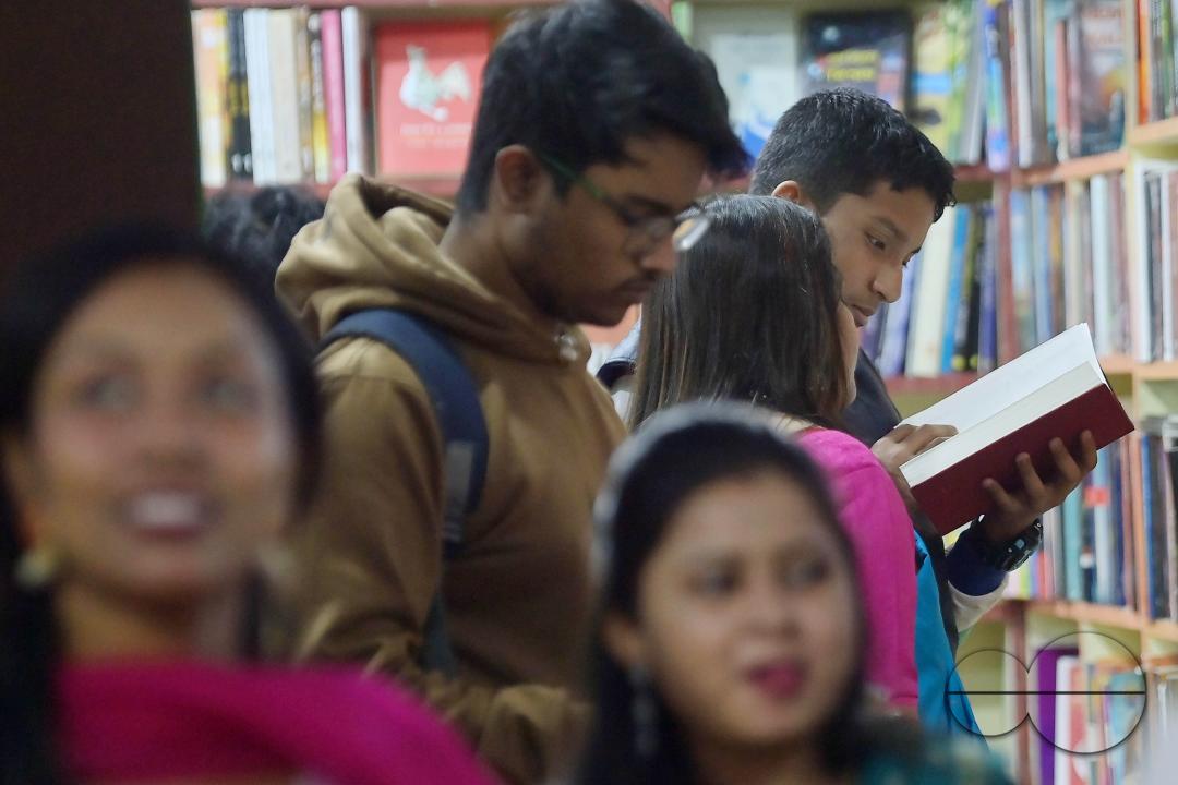People looking at books in a book stall at the 42nd Agartala Book fair International Fair Ground, Hapania at Agartala