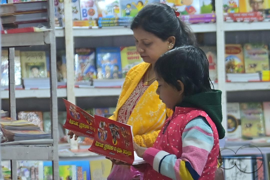People looking at books in a book stall at the 42nd Agartala Book fair International Fair Ground, Hapania at Agartala