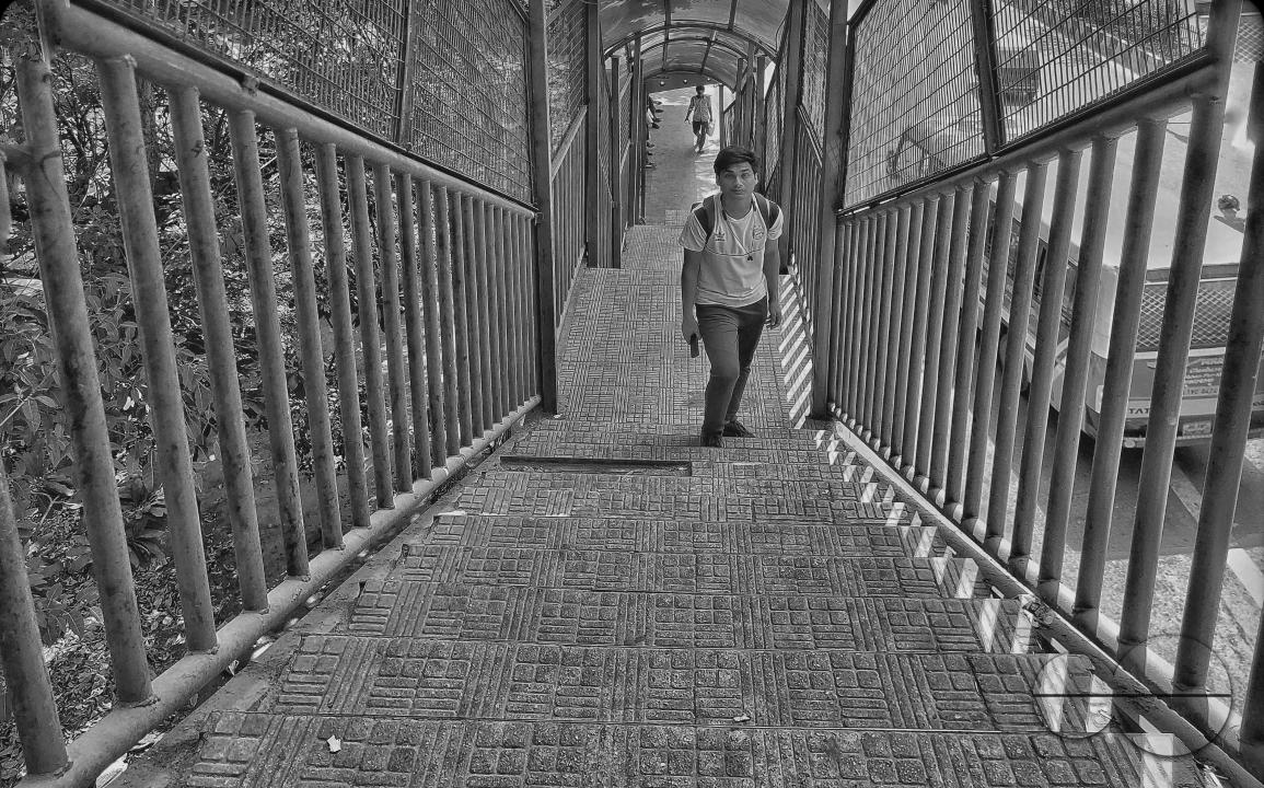 A boy walking up the steps at the Balukhali refugee camp