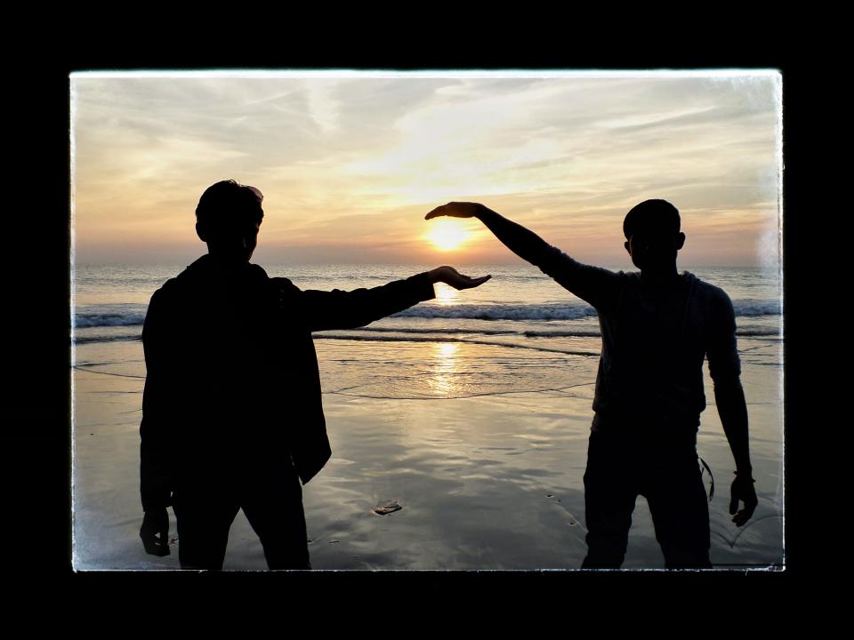 Two boys enjoying the beach in Bangladesh.