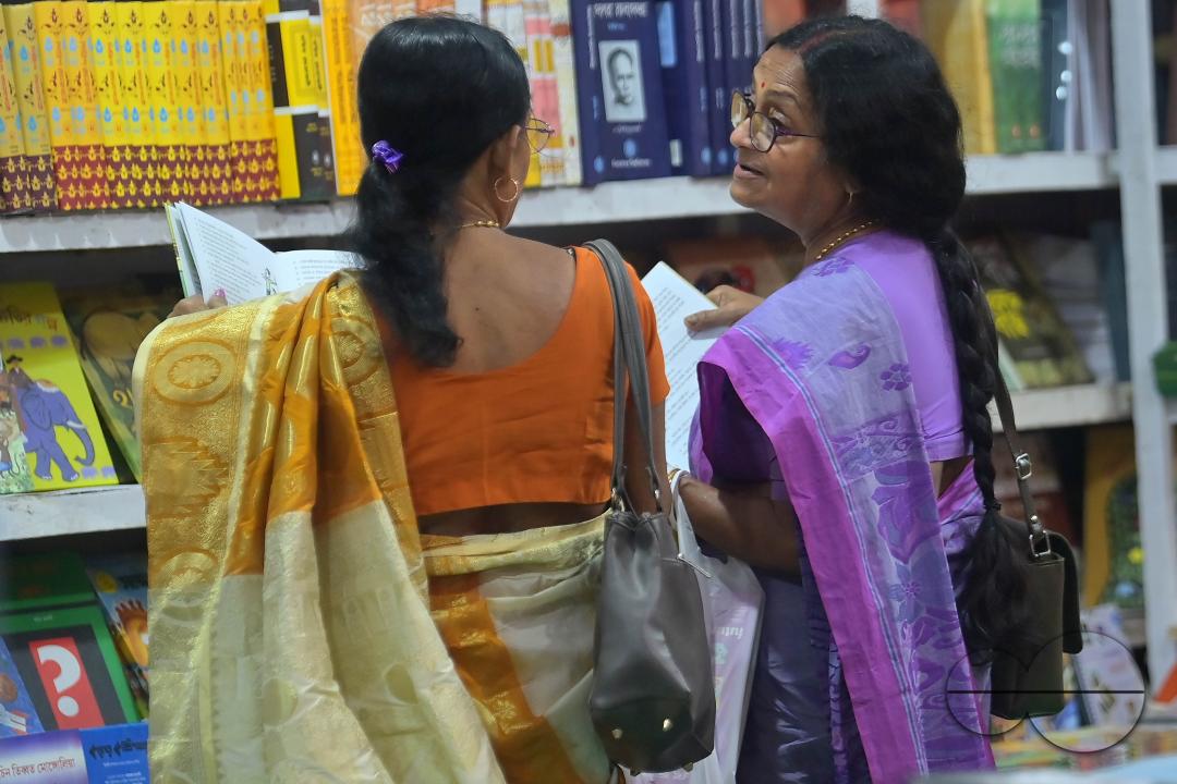 People looking at books in a book stall at the 42nd Agartala Book fair International Fair Ground, Hapania at Agartala