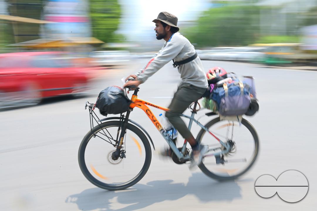 Sampoorn Shukla, a 23-year old Radio Jockey from Ashiyana, Lucknow, seen riding a bicycle during his India tour with the theme âJoin humanity save nature," in Agartala