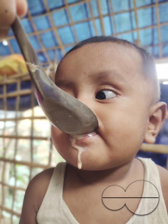 A child been fed soup at the Balukhali refugee camp
