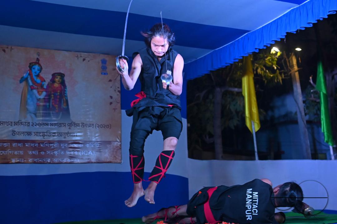Manipuri martial arts students performing at the opening program of the 225th Raas Festival in Radha madhab Mandir at Agartala