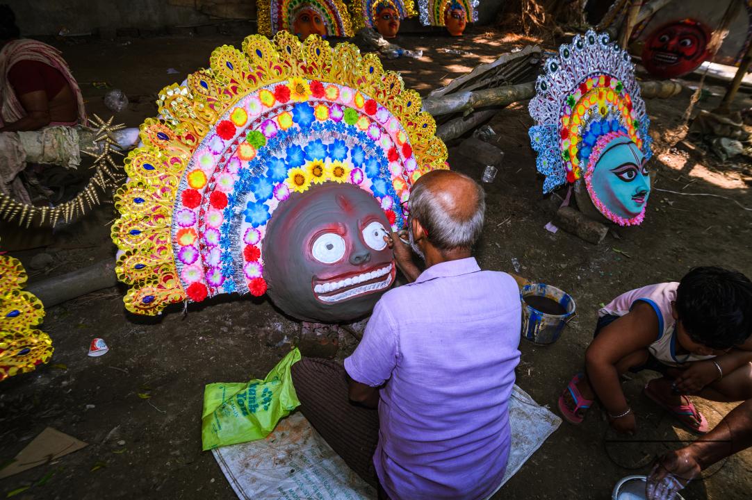 A village idol artist makes large color masks modeled after Purulia Chhau dance masks (Purulia Chhau dance is listed on UNESCO's World Heritage list of dances) of goddesses, animals, and rakshasas (humanoid demons or unrighteous spirits) like Hindu mytho