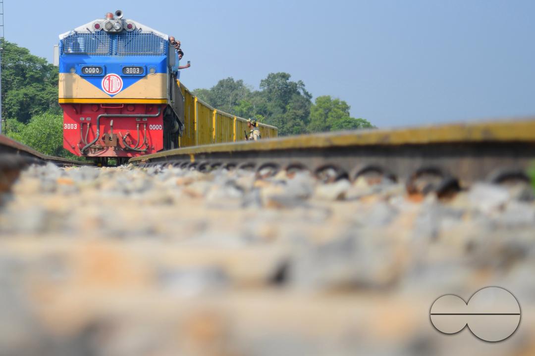 Indian people looking at a trial train and taking photographs, which is crossing the Indo-Bangladesh border