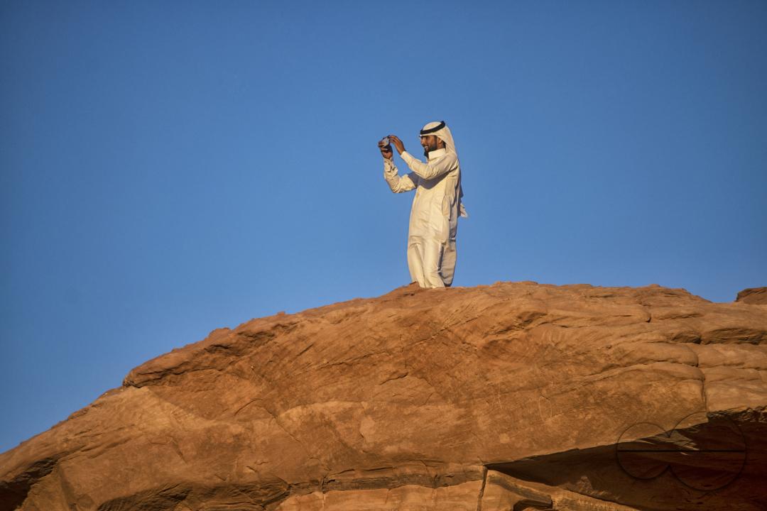 A male bedouin on top of a rock at Wadi Rum