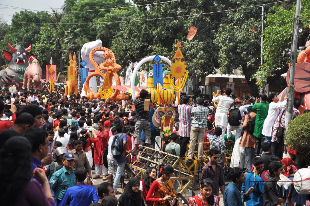 People celebrating in a colorful parade on the streets as a part of New year celebrations