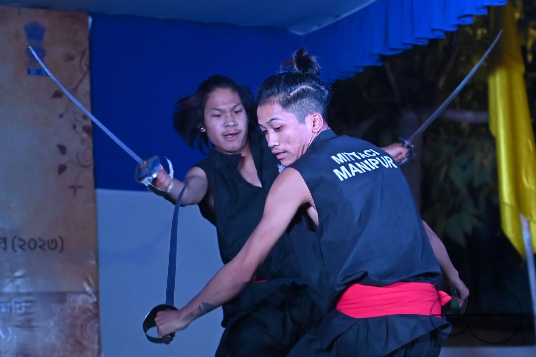 Manipuri martial arts students performing at the opening program of the 225th Raas Festival in Radha madhab Mandir at Agartala