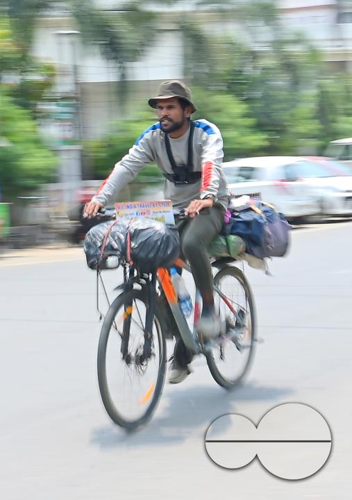 Sampoorn Shukla, a 23-year old Radio Jockey from Ashiyana, Lucknow, seen riding a bicycle during his India tour with the theme âJoin humanity save nature," in Agartala